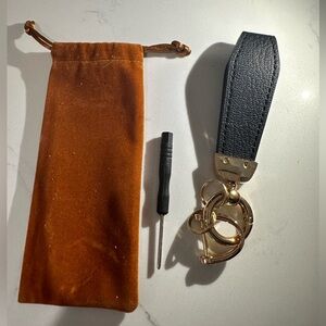 Black leather car key lanyard with gold clasp and gold key rings